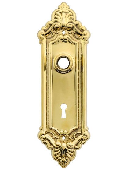 Stamped Brass French-Baroque Back Plate with Keyhole in Un-Lacquered Brass.
